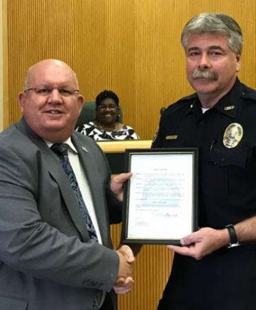 Mineola Mayor Kevin White presented the “Texans against Crime” proclamation to Police Chief Chuck Bittner.  